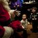 Dearborn resident Ellen Laney, two, greets Santa as he enters Conor O'Neill's on Sunday. Daniel Brenner I AnnArbor.com